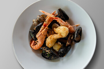 Sardinian ravioli culurgiones with crustaceans and shellfish