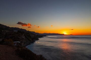 Obraz premium Beautiful landscape. Coast of the island of Crete - Greece area of Lerapetra Eden Rock. Beautiful sky at sunrise over the sea.