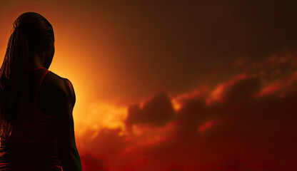 a silhouette of a female athlete with a red sky in the background. back view. Generative AI