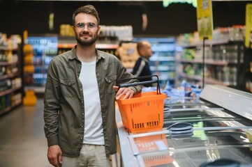 Smiling Male Customer Doing Grocery Shopping