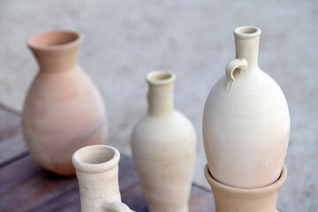 Fototapeta na wymiar Clay jars and jugs at the traditional market in old Dubai, UAE