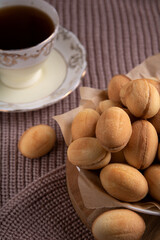 nuts with condensed milk and a cup of coffee on the sweater
