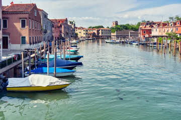Fototapeta na wymiar Boatyard with many boats on the water in Venice, Italy.