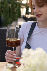 Young woman drink filter coffee from wineglass