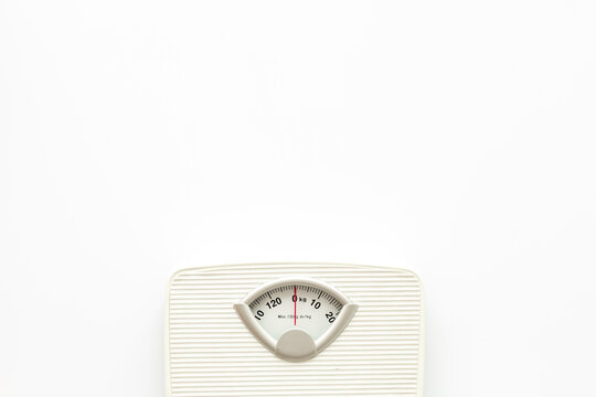 White floor weight scales top view. Body weight control and slimming concept