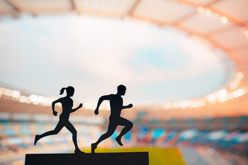 Running as One: Silhouettes of Male and Female Runners Unite, Elegantly Blending their Energies in Front of a Modern Sports Stadium
