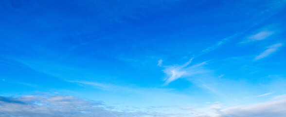 Naklejka na ściany i meble Blue sky with light clouds shot at 30 mm focal length