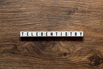 Teledentistry - word concept on building blocks, text