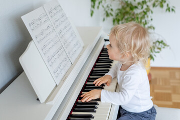 little child playing piano	