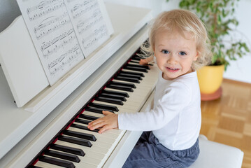 little child playing piano