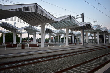 Fototapeta premium railway station in the city on a sunset 