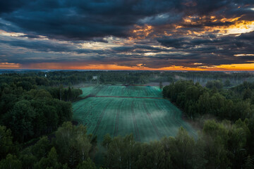 Aerial view of sunset over countryside fields