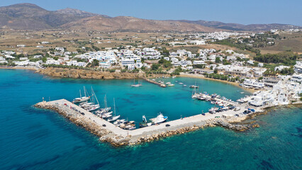 Aerial drone photo of small port and beach of Piso livadi in island of Paros, Cyclades, Greece