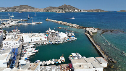 Aerial drone photo of picturesque small seaside village of Naoussa with traditional Cycladic...