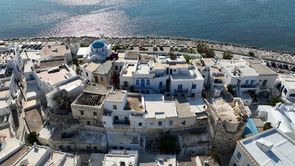 Aerial drone photo of traditional settlement and Frankish Castle of Paroikia with unique Cycladic...
