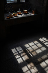 Ingredients to make Conventual Sweets, illuminated by sunlight coming through an ancient Monastery window, Portugal.