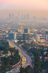 Naklejka na ściany i meble Breathtaking Los Angeles at Evening Hour: Captivating Cityscape and Vibrant Dusk Traffic in Stunning 4K