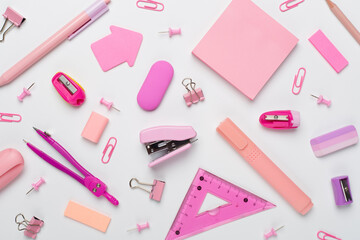 Pink school stationery on color backgroung, top view