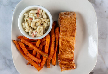 bake salmon  top with barbecue sauce  with fries