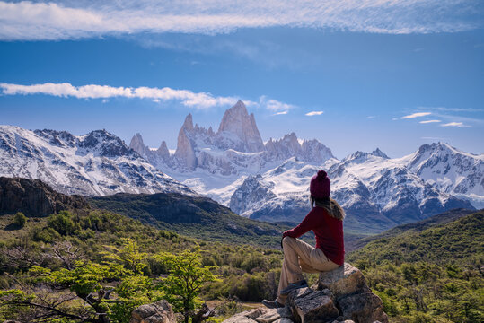 Woman sitting on the point view overlooking Mount Fitz Roy