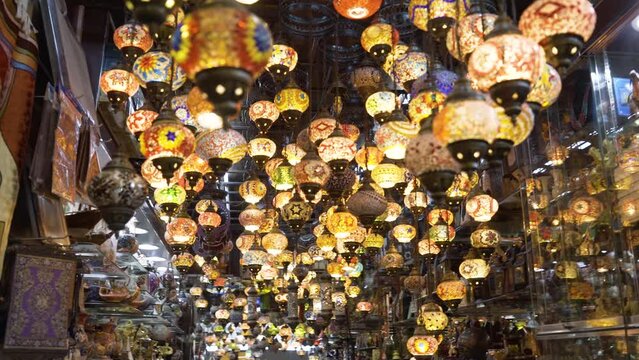 Store of authentic arabic colored lamps with all these handmade lights on, in Bahrain 	