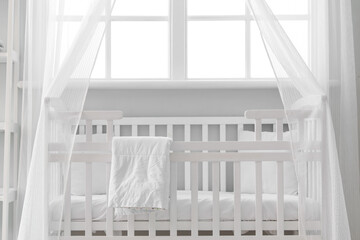 Fototapeta na wymiar Interior of stylish children's bedroom with crib