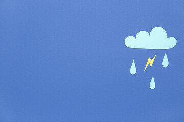 Paper cloud with rain drops and lightning on blue background. Weather forecast concept