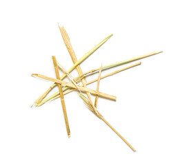 Straws scattered on white background