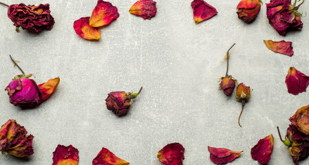 autumn background with dry rose petals for banner postcard background with free space for text