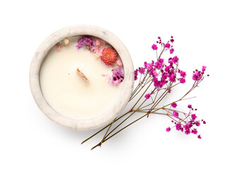 Holder with candle and flowers on white background