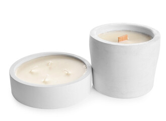 Holders with candles on white background