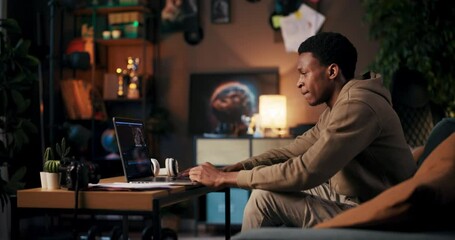 American dedicated student pursuing higher education enrolled in online degree program taking remote classes using computer to engage in virtual lectures, research, and assignments.