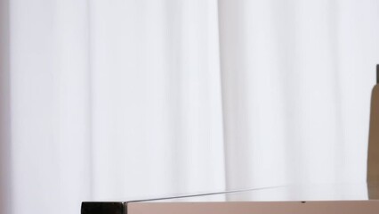 A man turns off the morning alarm clock with his hand, wake up the sleeping man in bed. It's time to get up, on the alarm clock 6 in the morning. Morning rise of a person. Alarm clock woke up a man