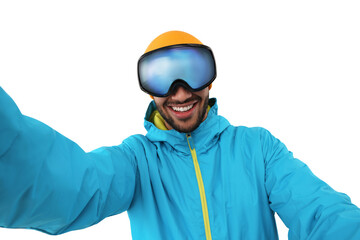 Smiling young man in ski goggles taking selfie on white background