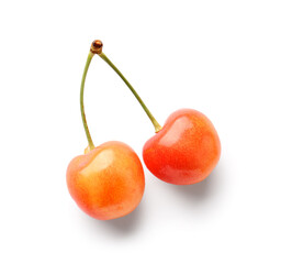 Sweet yellow cherries on white background