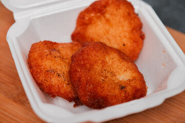 Nuegados from El Salvador Central America shot on a wooden block in it's traditional packaging