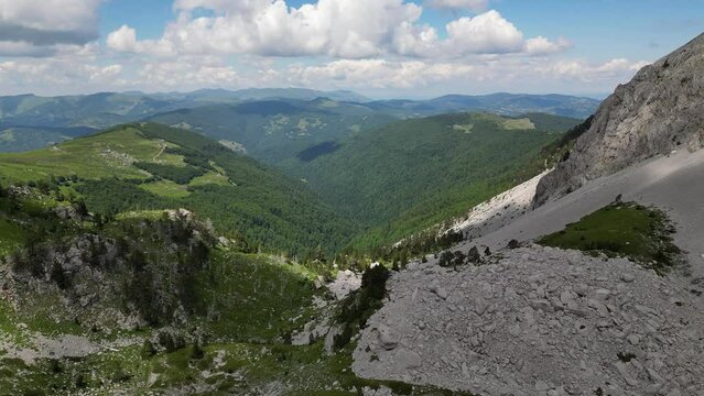 Beautiful epic rocks with scatterings of stones and coniferous trees. Mountains Komovi. Montenegro. Aerial view.