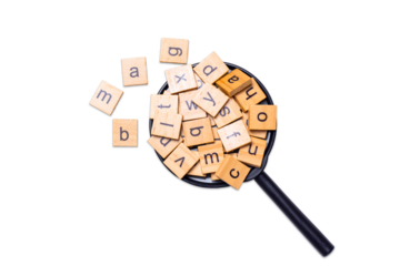 English alphabet made of square wooden tiles with the English alphabet scattered on white background. The concept of thinking development, grammar.