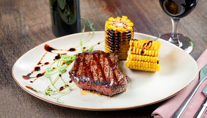 grilled beef steak with corn and balsamic sauce restaurant serving
