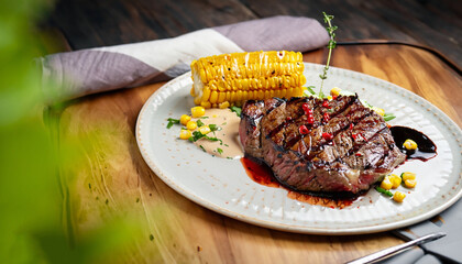 grilled beef steak with corn and balsamic sauce restaurant serving