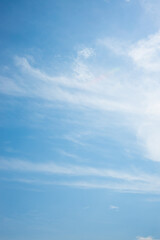 Obraz premium Clouds in the blue sky. Summer blue sky cloud gradient light white background. Beauty clear cloudy in sunshine calm bright winter air bacground. Image of beautiful blue sky.