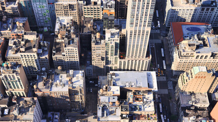 Aerial of the busy City of New York with skyscrapers and the busy streets with vehicles and people...