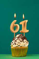 Birthday card with candle number 61 - Green background