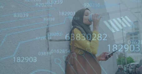 Animation of data processing ovr biracial woman in hijab using smartphone drinking coffee on street