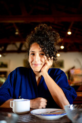Relaxed woman drinking a cup of coffee,