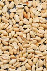 Whole shelled peanut nuts kernels close-up studio background