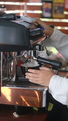barista making a cup of latte art in the coffee shop