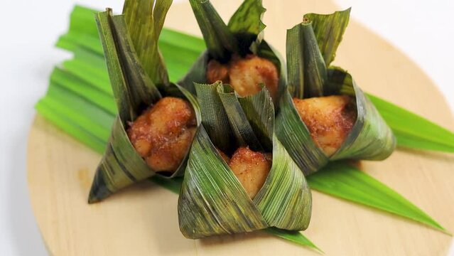 Close-up of fried chicken with pandan leaves