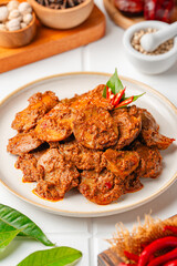 Rendang Jengkol, dogfruit simmered in spices and coconut milk. Indonesian traditional comfort food, with a spicy savory taste typical of rendang and a legit jengkol texture.