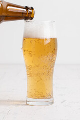 グラスに注がれるビール　beer being poured into a glass